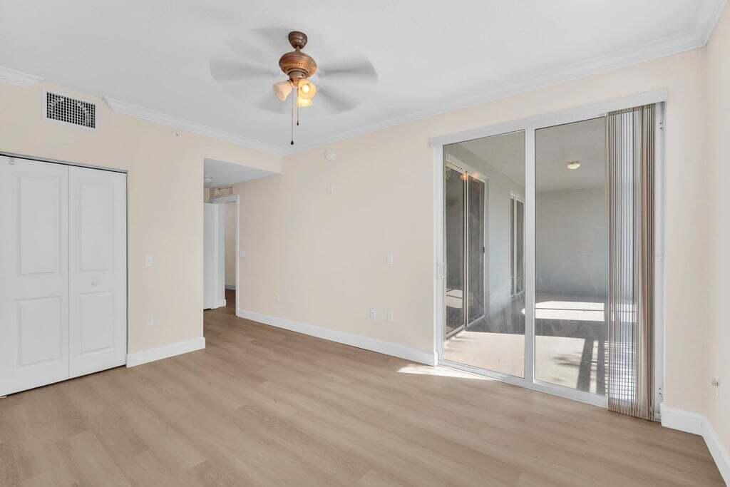 1690 Renaissance Commons Boulevard, Unit 1219 Boynton Beach, FL 33426 - Photo 26 of 38 a view of an empty room and window
