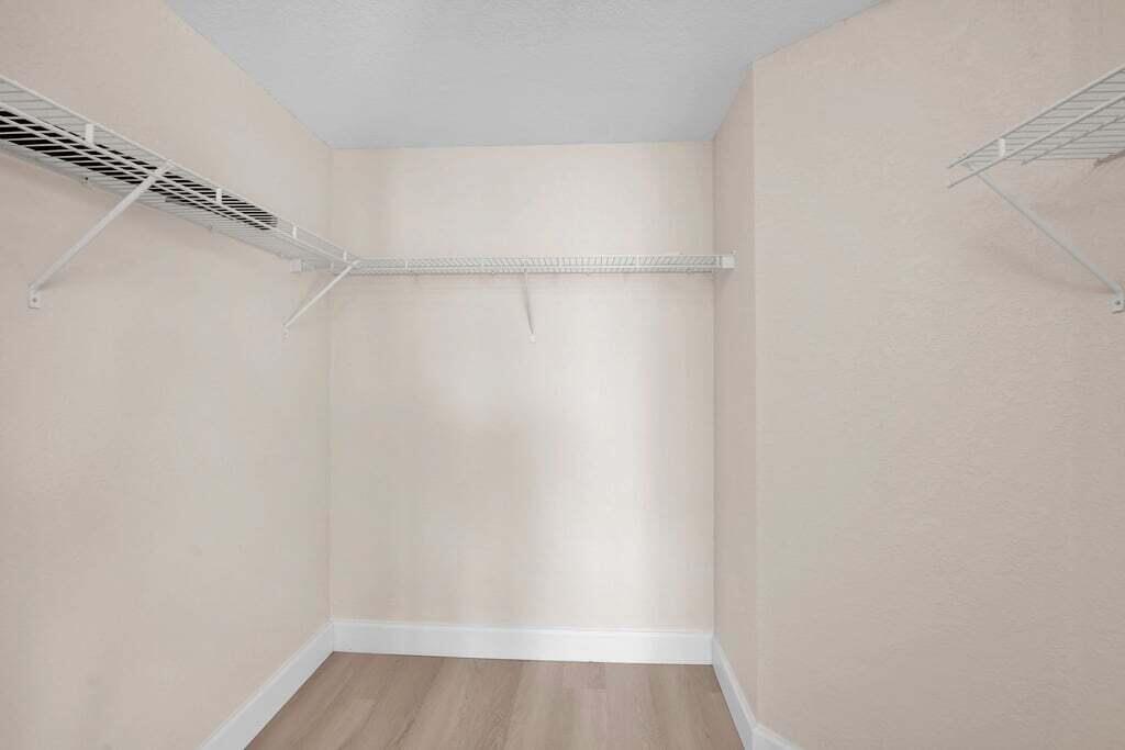 1690 Renaissance Commons Boulevard, Unit 1219 Boynton Beach, FL 33426 - Photo 27 of 38 a view of a room with shelf on the wall