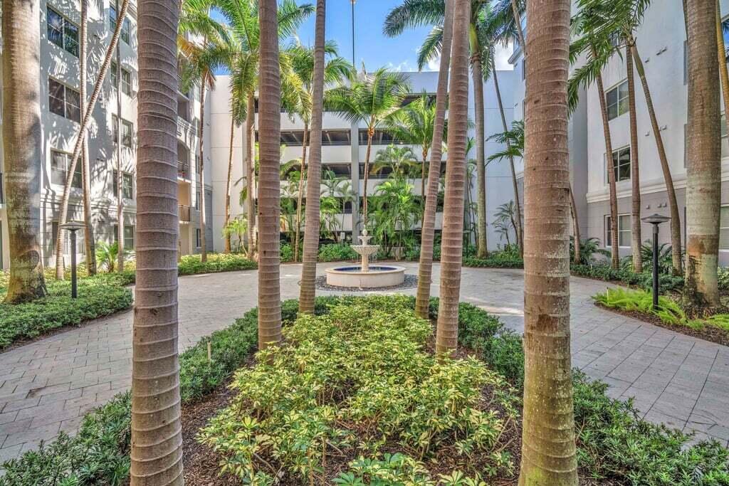1690 Renaissance Commons Boulevard, Unit 1219 Boynton Beach, FL 33426 - Photo 36 of 38 a view of a garden with a plant