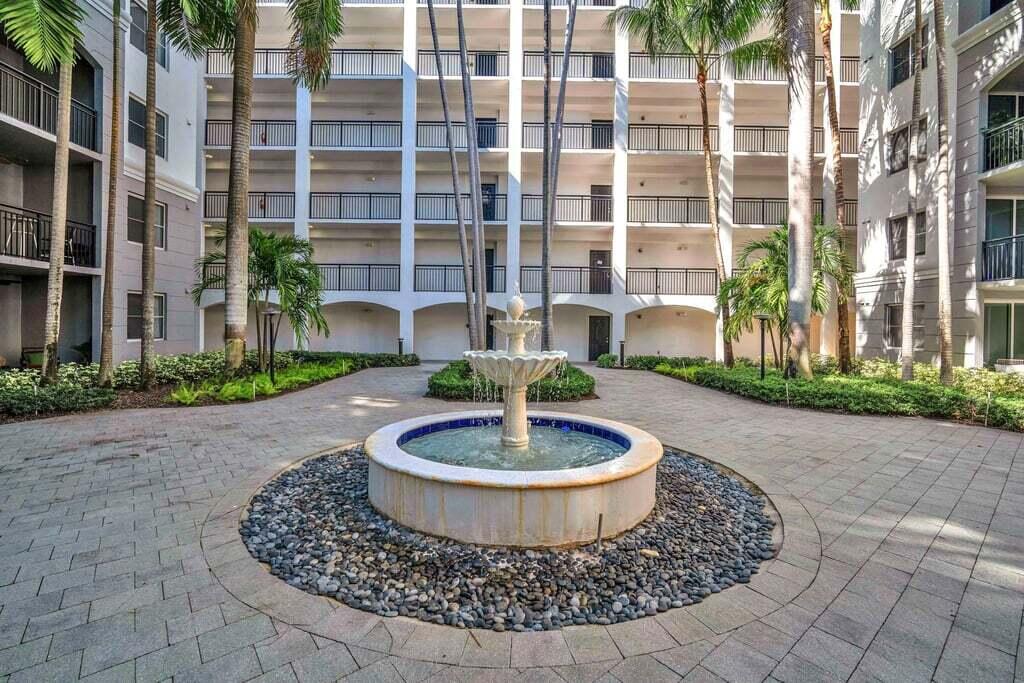 1690 Renaissance Commons Boulevard, Unit 1219 Boynton Beach, FL 33426 - Photo 37 of 38 a view of a water fountain in the middle of a building