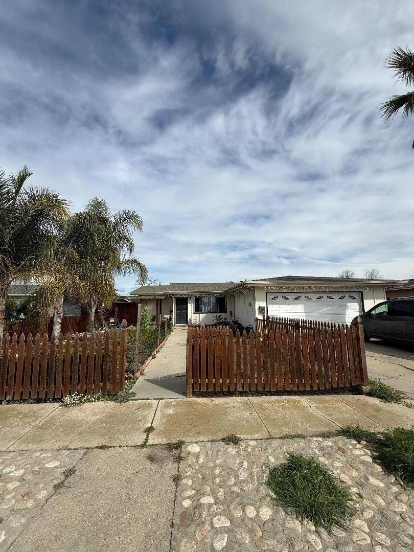 244 Larson Lane Greenfield, CA 93927 - Photo 1 of 5 a view of a house with wooden fence