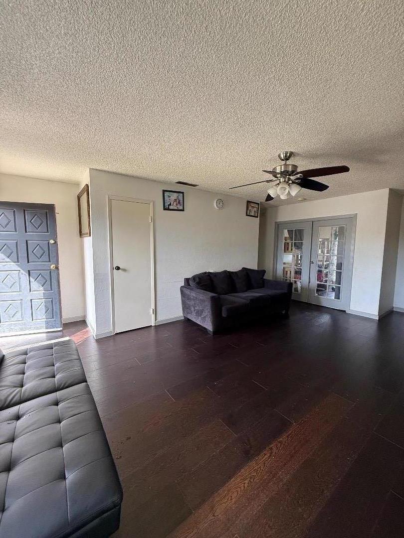 244 Larson Lane Greenfield, CA 93927 - Photo 4 of 5 a living room with furniture and a chandelier