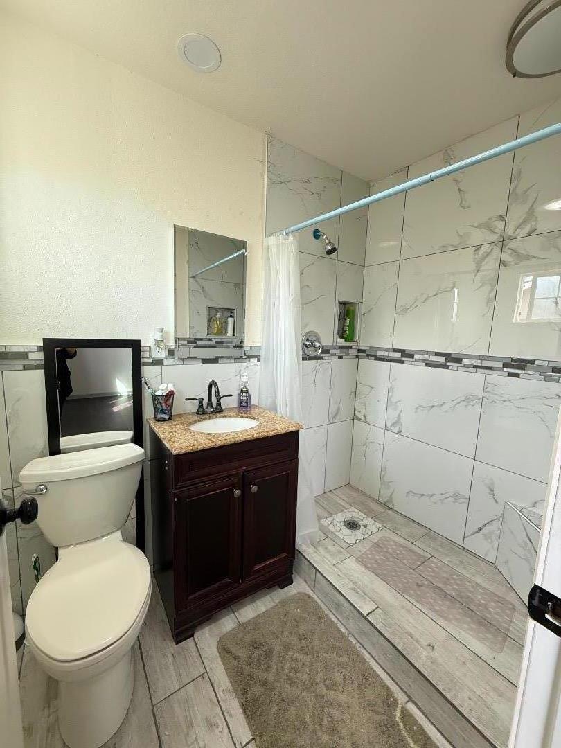 244 Larson Lane Greenfield, CA 93927 - Photo 5 of 5 a bathroom with a sink a toilet and shower