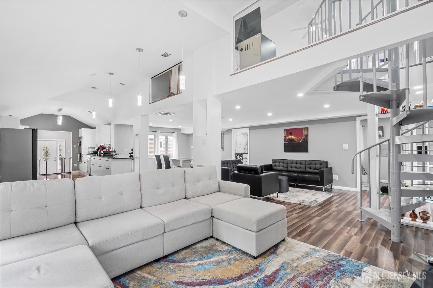 6 Kates Mount Iselin, NJ 08830 - Photo 15 of 29 a living room with furniture a wooden floor and a chandelier
