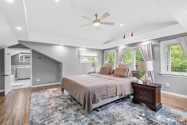 a bedroom with a large bed and a window