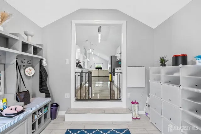 a view of an entryway with wooden floor