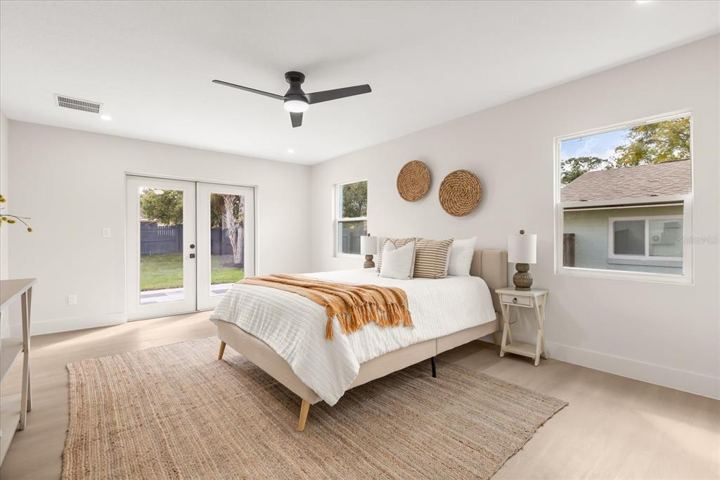 206 Graham Road Fern Park, FL 32730 - Photo 12 of 34 a bedroom with a large bed and a window