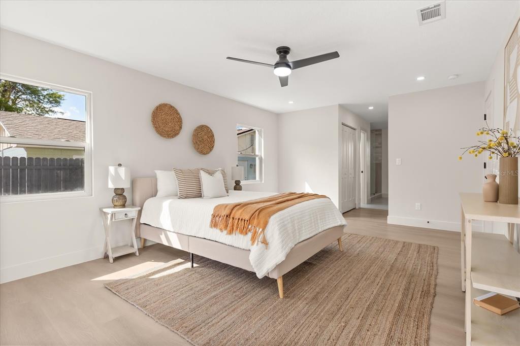 206 Graham Road Fern Park, FL 32730 - Photo 14 of 34 a bedroom with a large bed and a large window