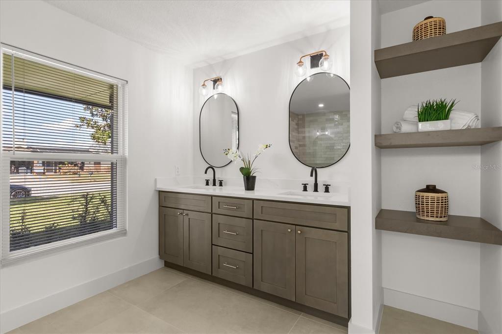 206 Graham Road Fern Park, FL 32730 - Photo 15 of 34 a bathroom with a sink and a mirror
