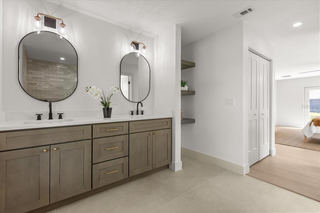 206 Graham Road Fern Park, FL 32730 - Photo 16 of 34 a bathroom with 2 sink and a mirror
