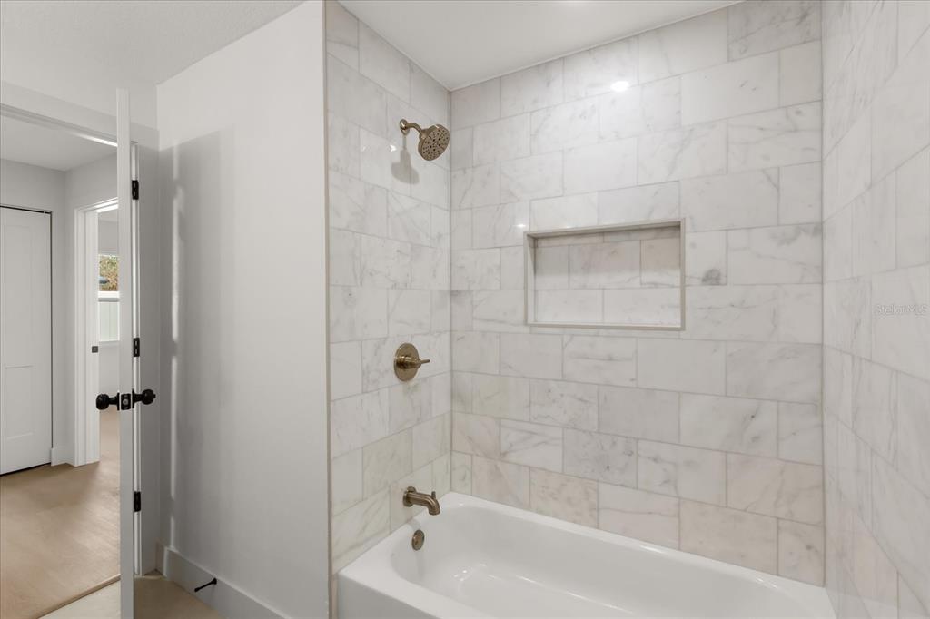 206 Graham Road Fern Park, FL 32730 - Photo 19 of 34 a bathroom with a bathtub