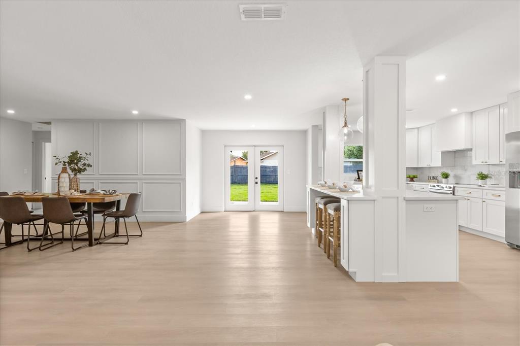 206 Graham Road Fern Park, FL 32730 - Photo 2 of 34 a open kitchen with white cabinets and stainless steel appliances