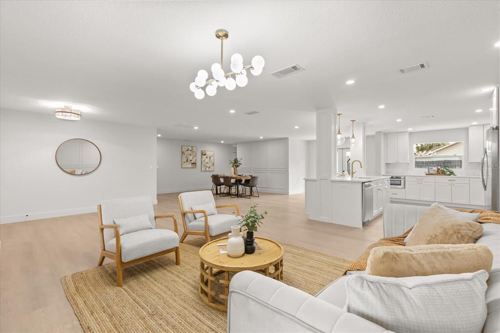 206 Graham Road Fern Park, FL 32730 - Photo 3 of 34 a living room with furniture kitchen view and a large mirror