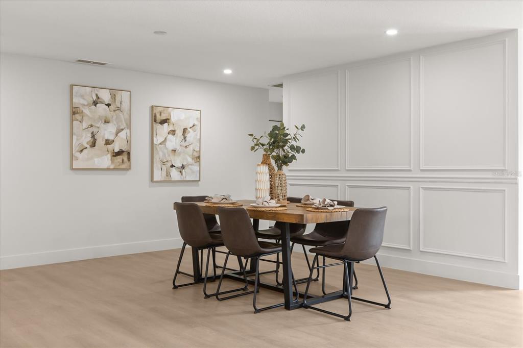 206 Graham Road Fern Park, FL 32730 - Photo 7 of 34 a view of a dining room with furniture and wooden floor