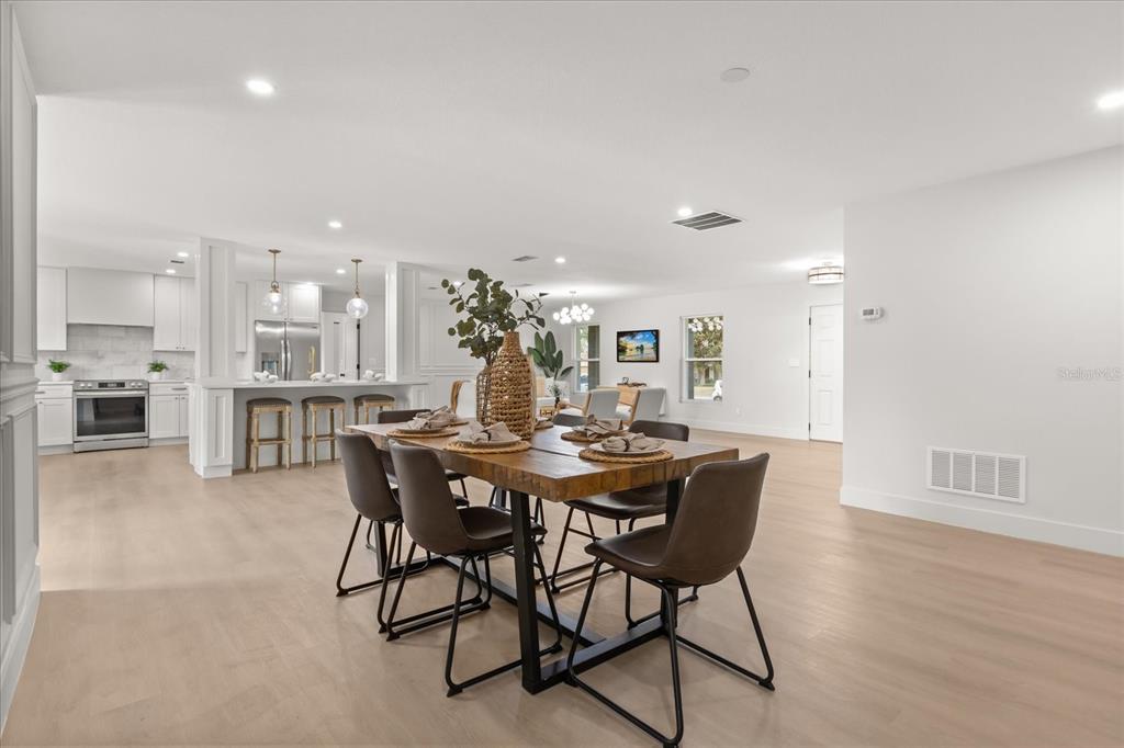 206 Graham Road Fern Park, FL 32730 - Photo 8 of 34 a view of a dining room with furniture and wooden floor