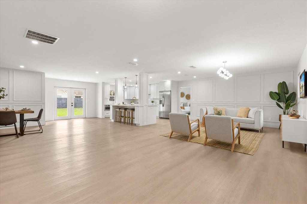 206 Graham Road Fern Park, FL 32730 - Photo 10 of 34 a view of a living room kitchen and a large window