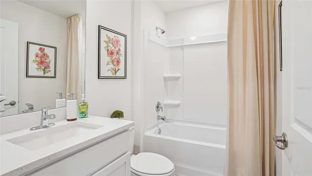 a bathroom with a sink toilet and bathtub
