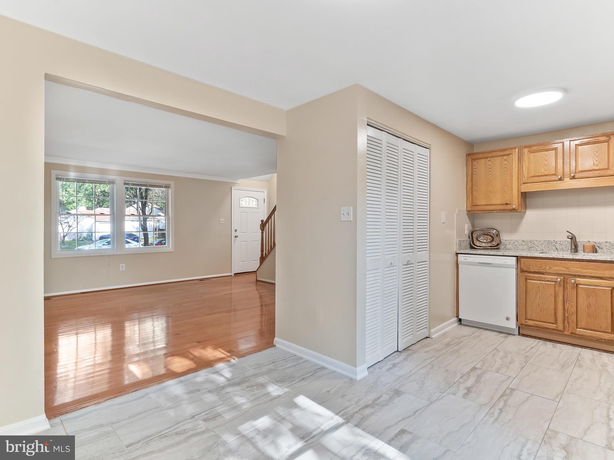 19044 Staleybridge Road Germantown, MD 20876 - Photo 13 of 30 a view of a kitchen with a sink dishwasher and a refrigerator