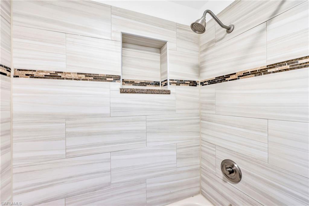 3231 13th Avenue Southwest Naples, FL 34117 - Photo 18 of 49 a bathroom with a shower