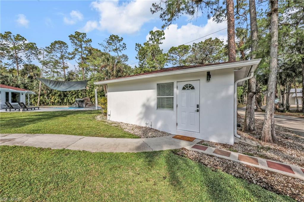 3231 13th Avenue Southwest Naples, FL 34117 - Photo 28 of 49 a view of a house with a yard