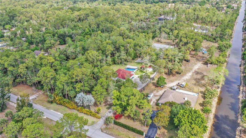 3231 13th Avenue Southwest Naples, FL 34117 - Photo 47 of 49 an aerial view of residential houses with outdoor space