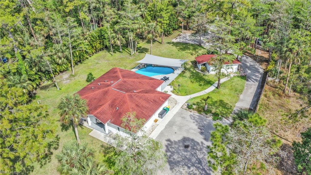 3231 13th Avenue Southwest Naples, FL 34117 - Photo 48 of 49 a view of a lake in front of house