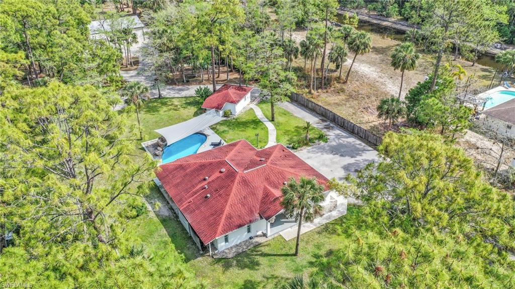 3231 13th Avenue Southwest Naples, FL 34117 - Photo 49 of 49 an aerial view of a house with a yard