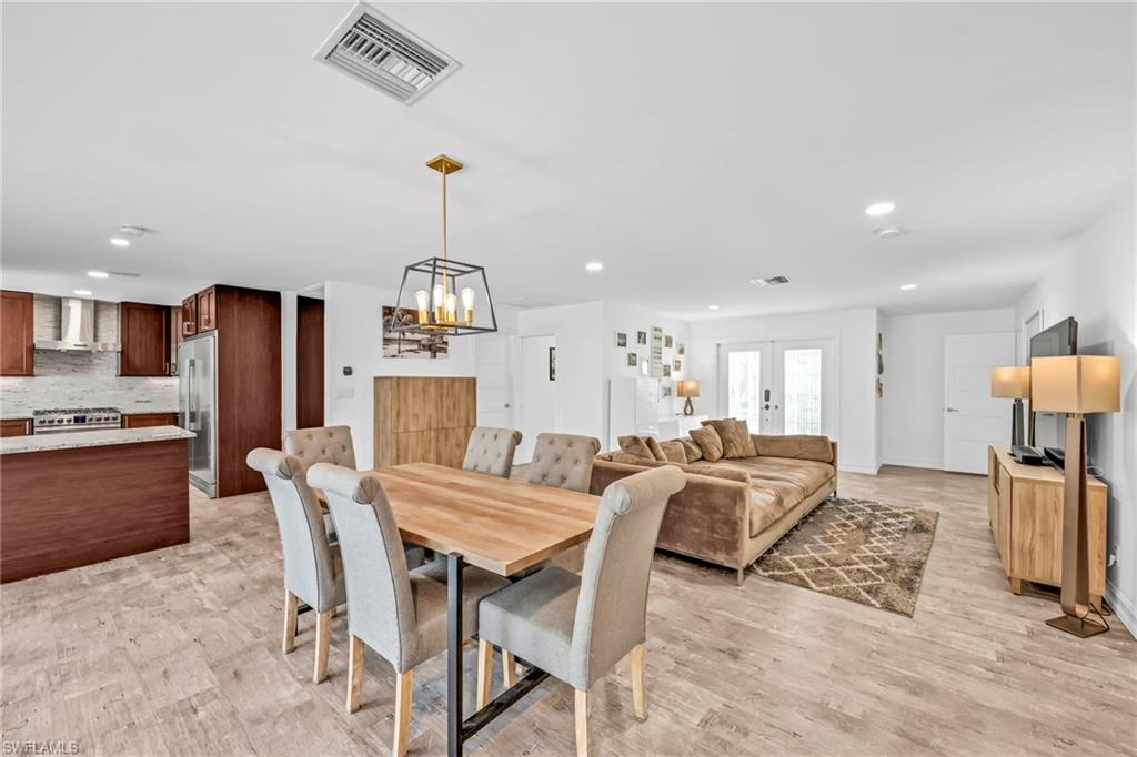 3231 13th Avenue Southwest Naples, FL 34117 - Photo 6 of 49 a view of a dining room with furniture