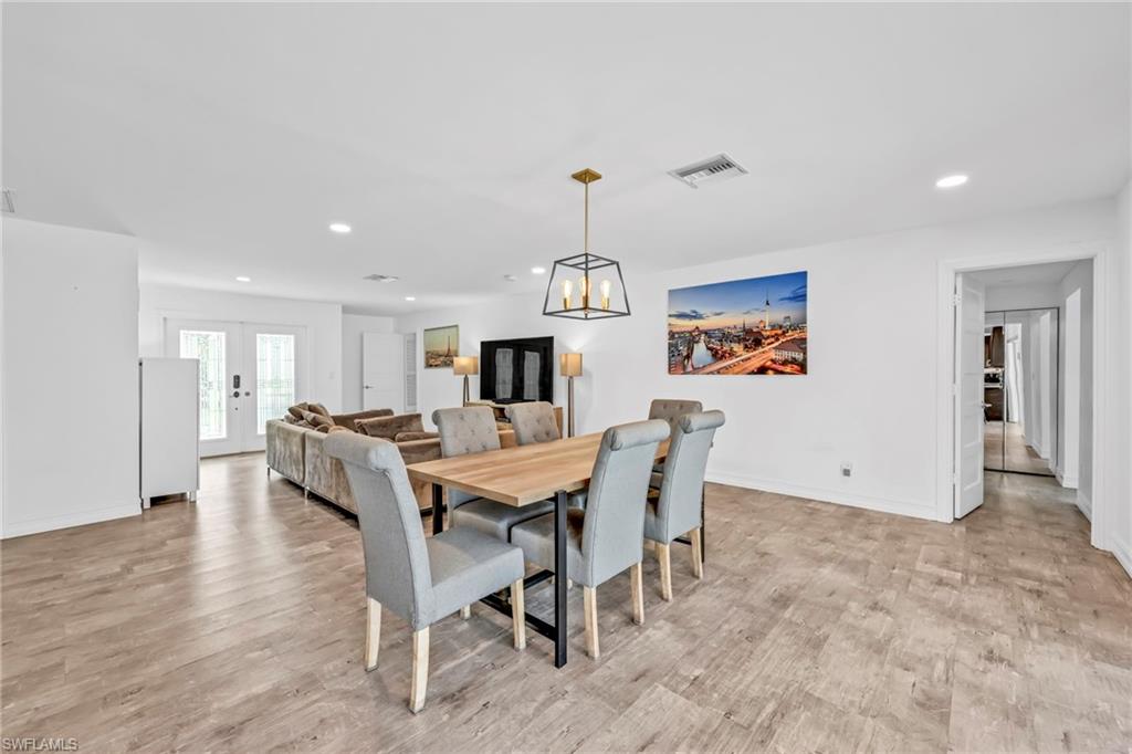 3231 13th Avenue Southwest Naples, FL 34117 - Photo 7 of 49 a view of a dining room with furniture