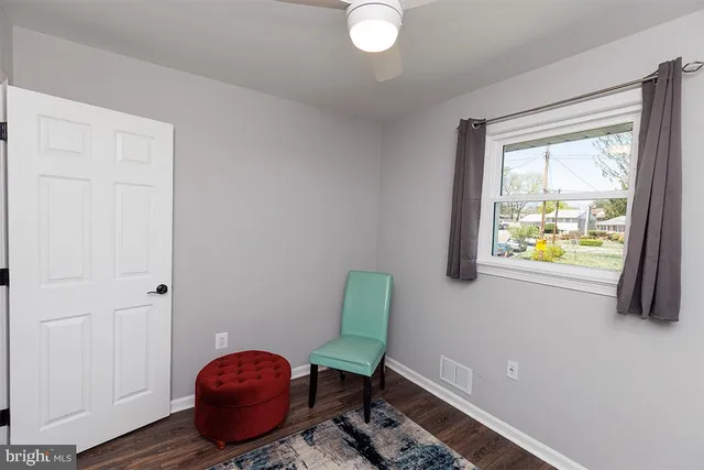 a view of room with window and lounge chair