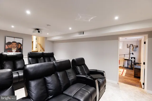 a living room with furniture a couch and a window