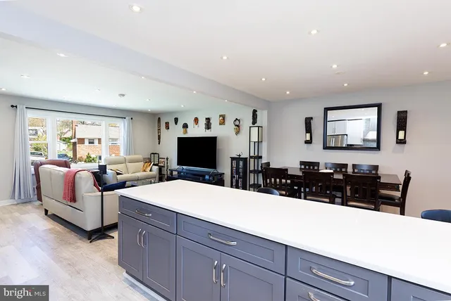 a large bedroom with a large bed and a flat screen tv