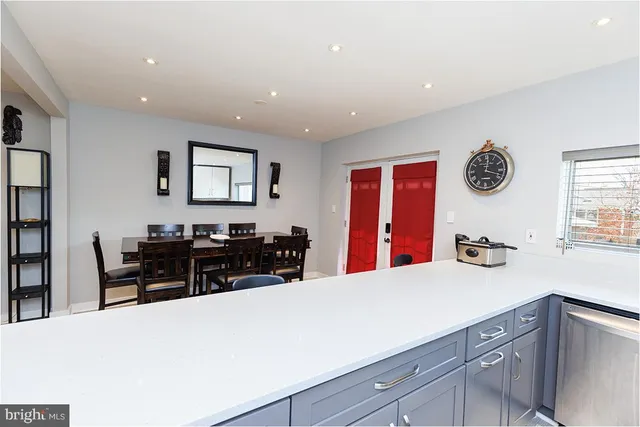 a kitchen with stainless steel appliances a refrigerator and stove