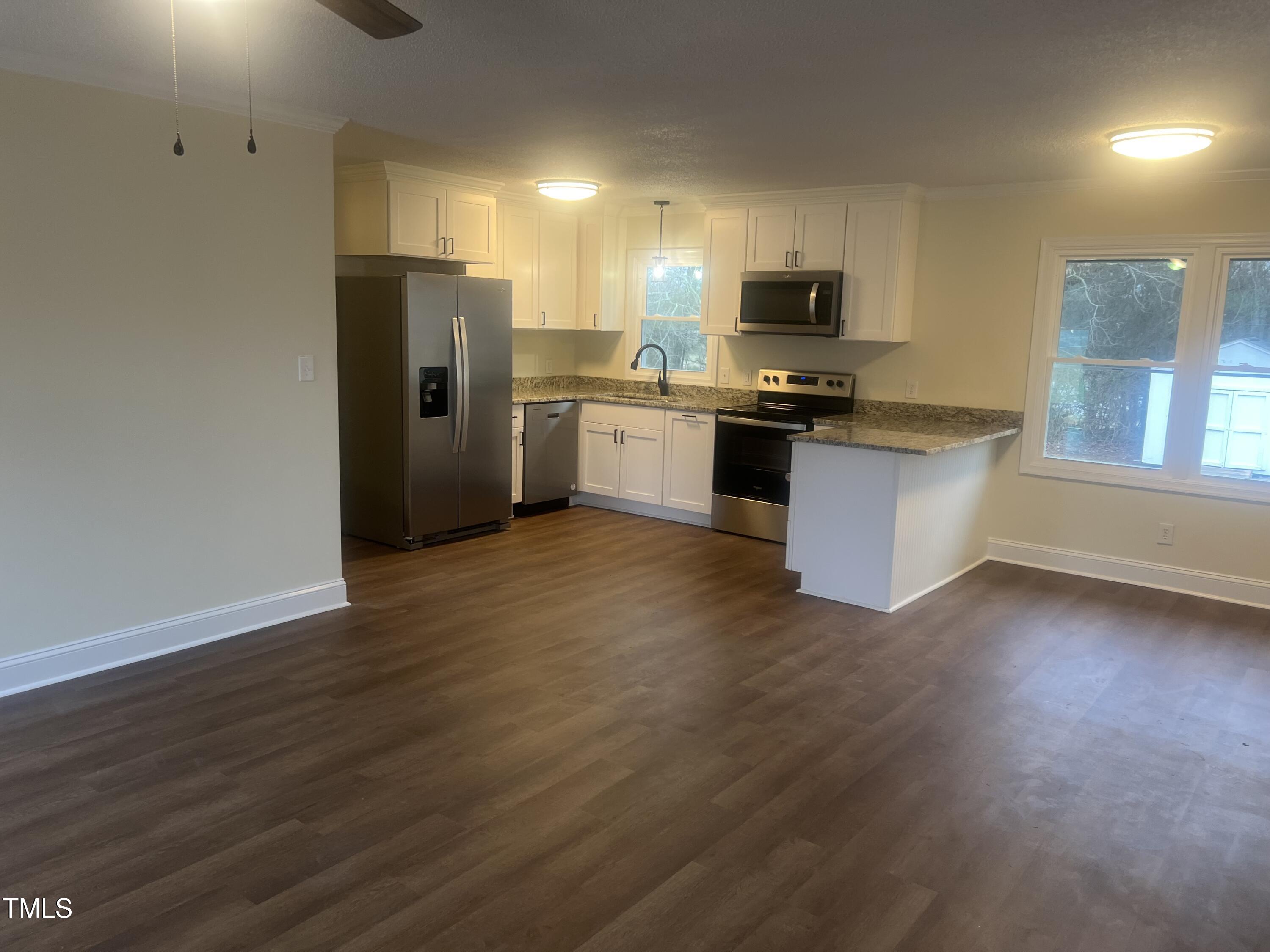 1166 Aquilla Road Benson, NC 27504 - Photo 13 of 32 Kitchen from Den