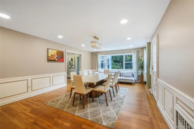 a dining room with furniture and wooden floor