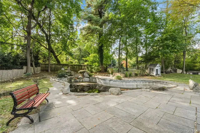 a view of a backyard with sitting area
