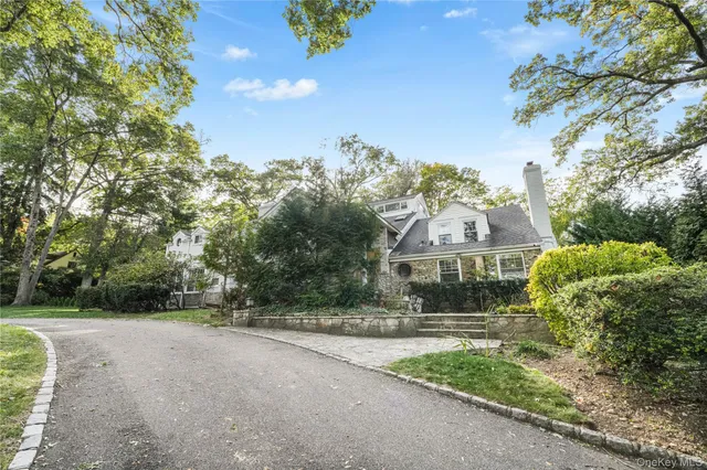 a view of a garden with a building in the background