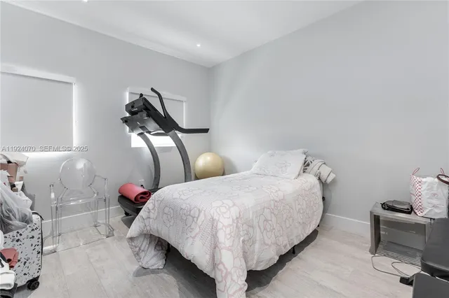 a bed room with two beds and a couch