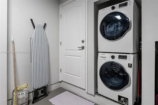 a view of a hallway with washer and dryer