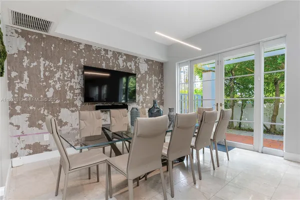 a view of a dining room with furniture window and outside view