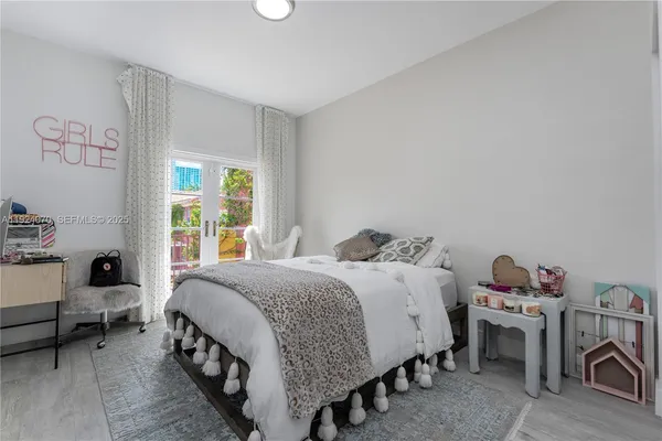 a bedroom with a bed and a table