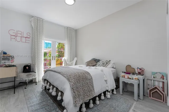 a bedroom with a bed and a table