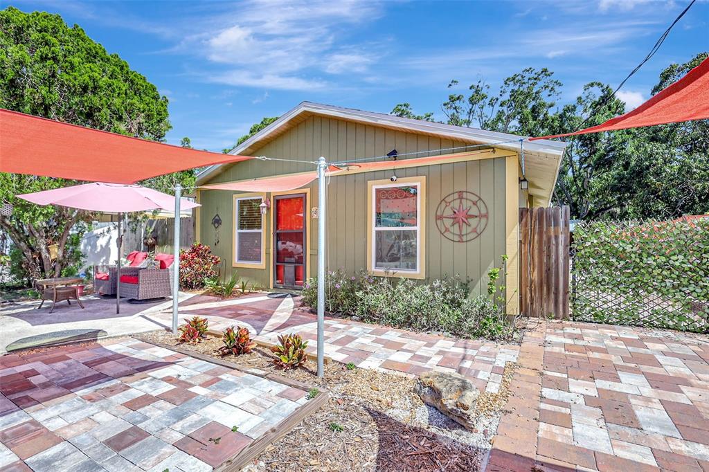 1489 18th Street Sarasota, FL 34234 - Photo 1 of 1 a front view of a house with garden