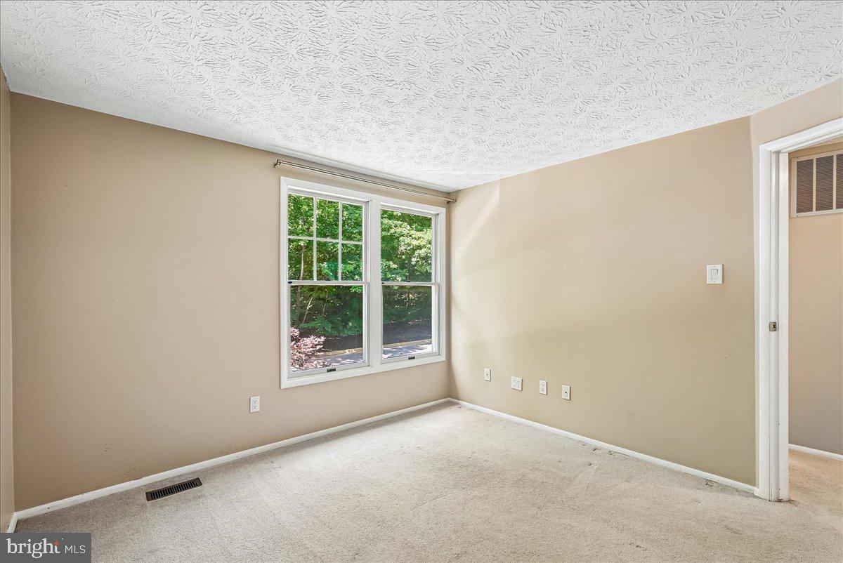 2331 Middle Creek Lane Reston, VA 20191 - Photo 37 of 78 a view of an empty room with a window