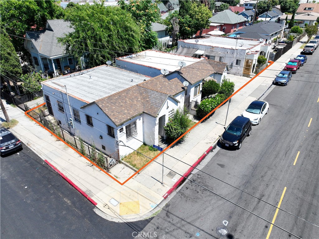 an aerial view of a house with a swimming pool