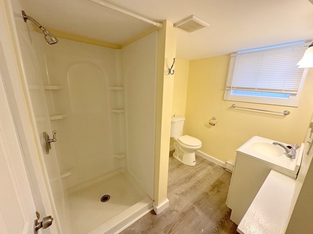 227 Bridge Street, Unit 3 Northampton, MA 01060 - Photo 12 of 19 a bathroom with a shower and a toilet