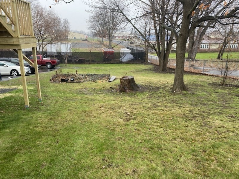 227 Bridge Street, Unit 3 Northampton, MA 01060 - Photo 19 of 19 a backyard of a house with lots of green space and fountain