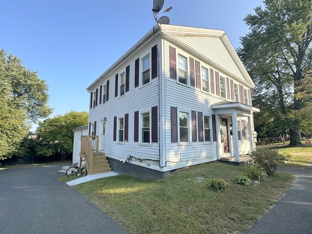 227 Bridge Street, Unit 3 Northampton, MA 01060 - Photo 2 of 19 a front view of a house with a yard
