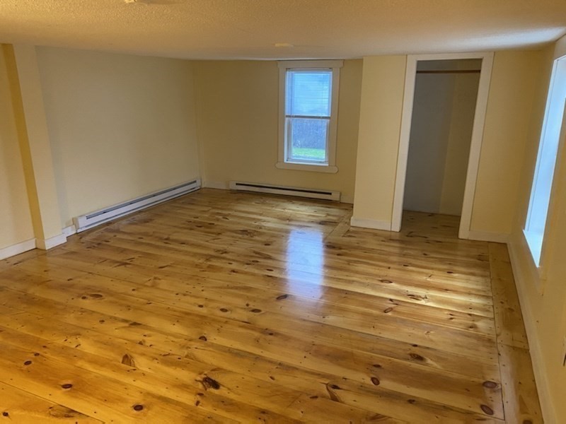 227 Bridge Street, Unit 3 Northampton, MA 01060 - Photo 7 of 19 a view of empty room with wooden floor