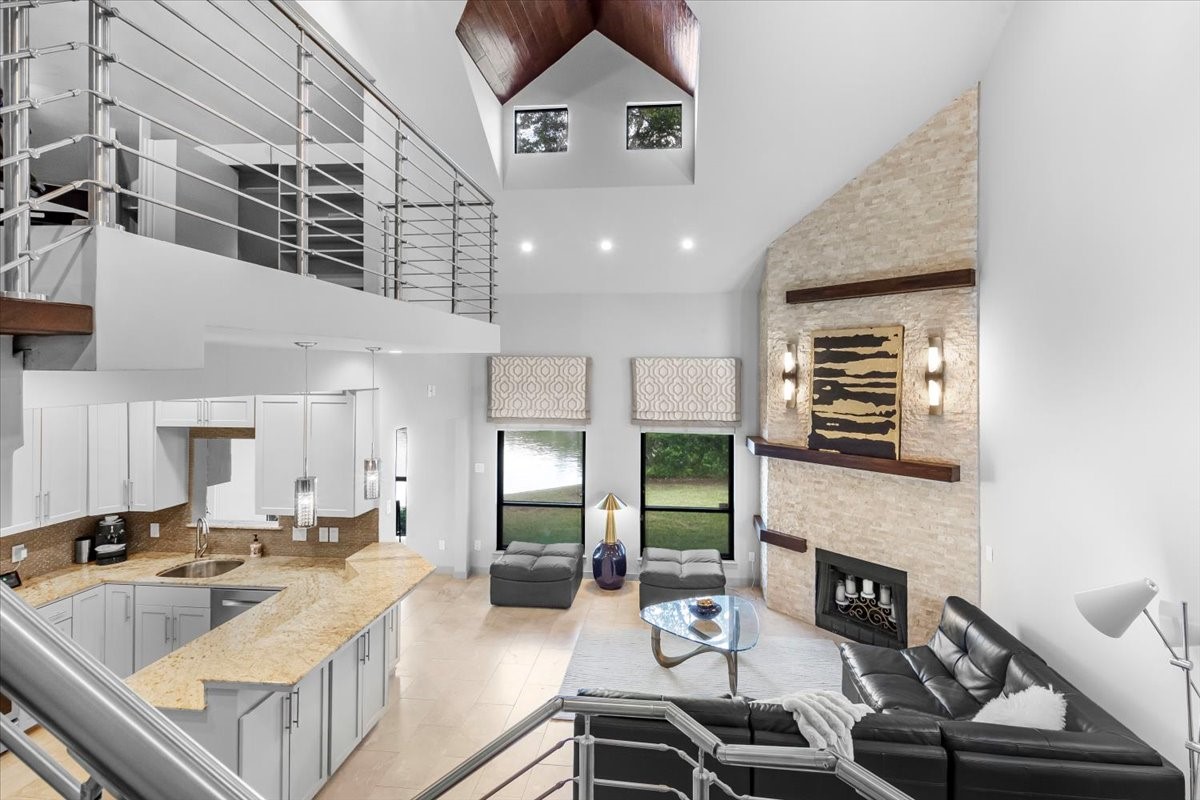 4144 Greystone Way, Unit 303 Sugar Land, TX 77479 - Photo 14 of 33 a living room with furniture and a fireplace